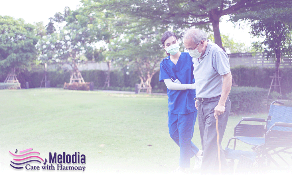 Hospice nurse helping patient with walk