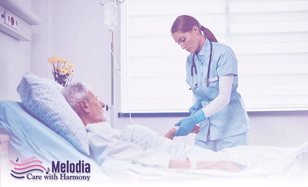 Compassionate nurse administering Artificial Nutrition and Hydration to an elderly patient via IV therapy at home .