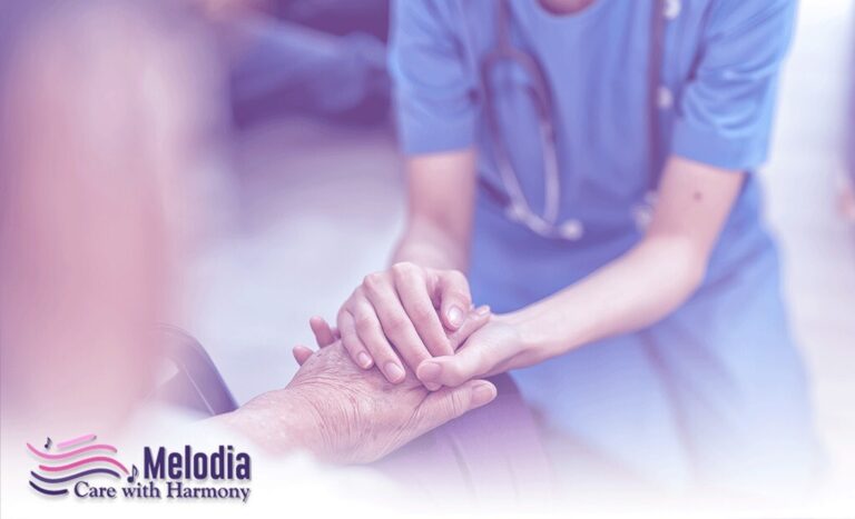 Young nurse holding elder person's hand in Respite Care