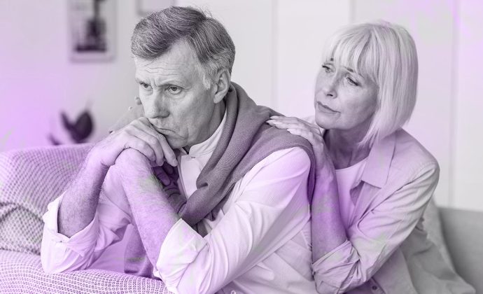 Woman offering bereavement support to a grieving man